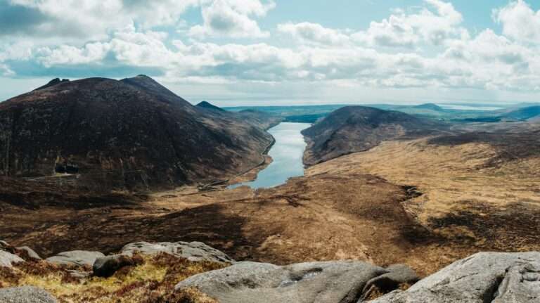 Granite peaks of the Mourne Mountains above a valley reservoir in County Down